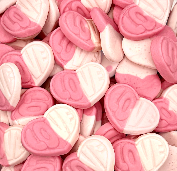Close-up of pink and white heart-shaped candies.